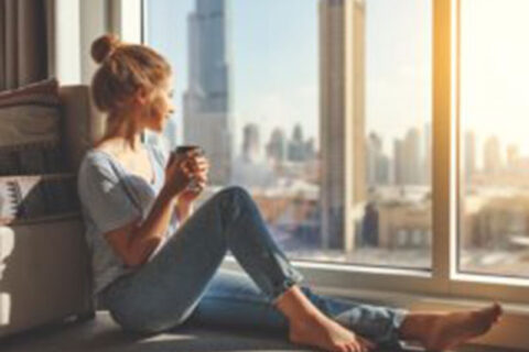 Women sitting at the window side