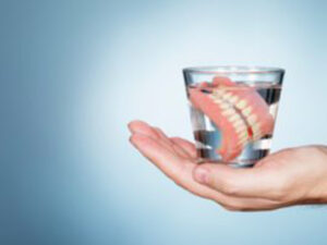 Tooth Denture inside a glass of water
